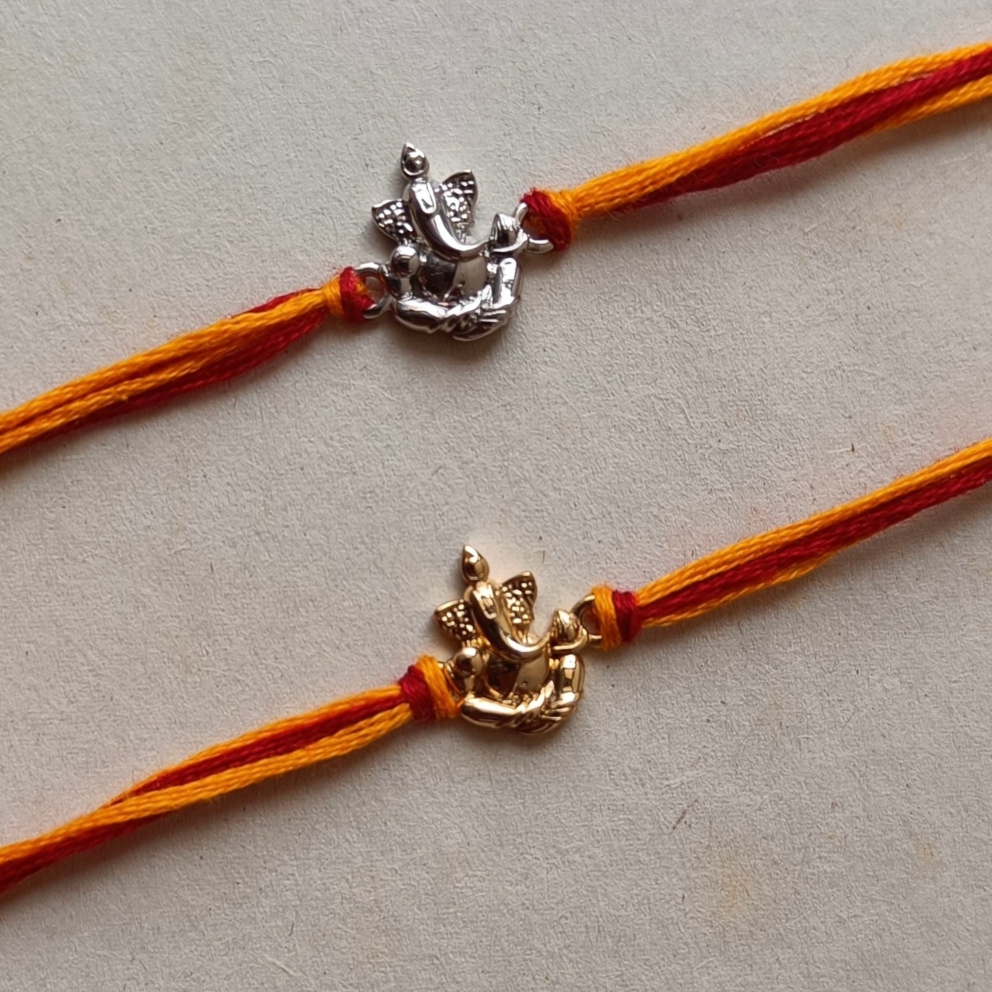 Blessed Ganesha 22 kt Gold Plated Silver Rakhi