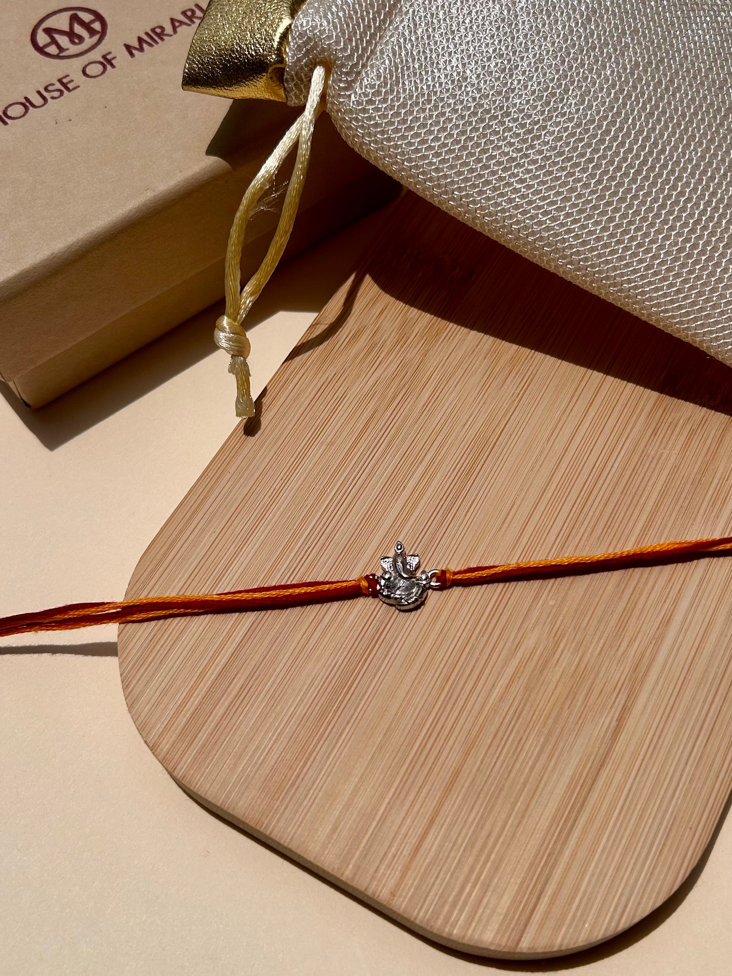 Blessed Ganesha Rhodium-Plated Silver Rakhi