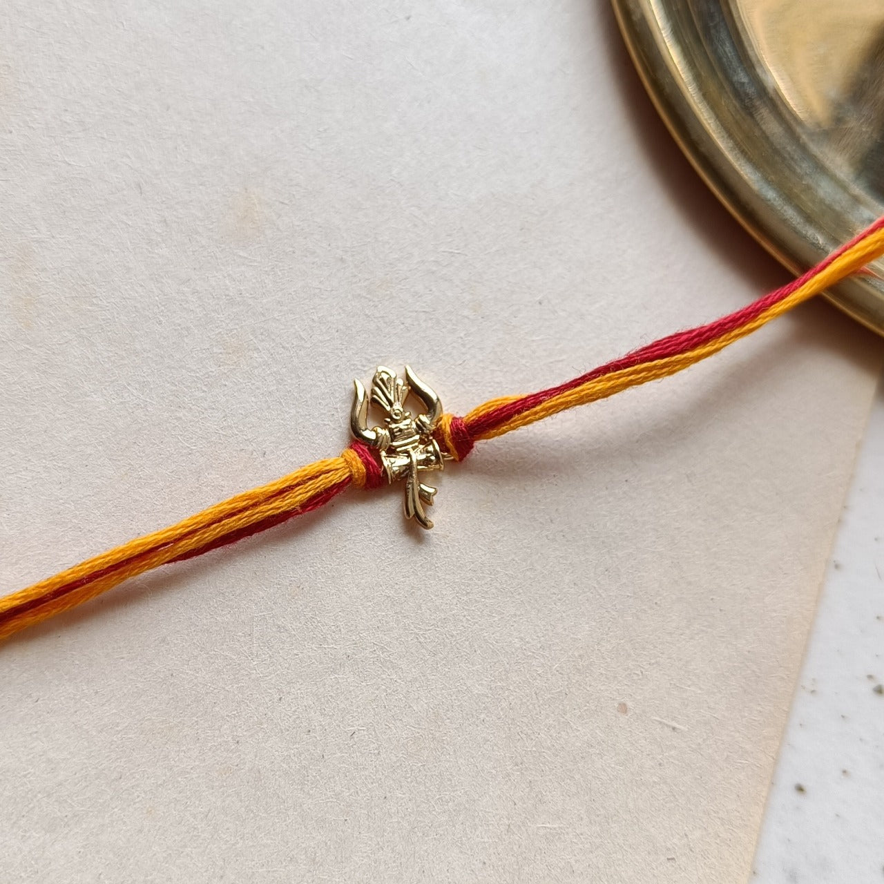Shiva Trishul 22kt Gold Plated Silver Rakhi
